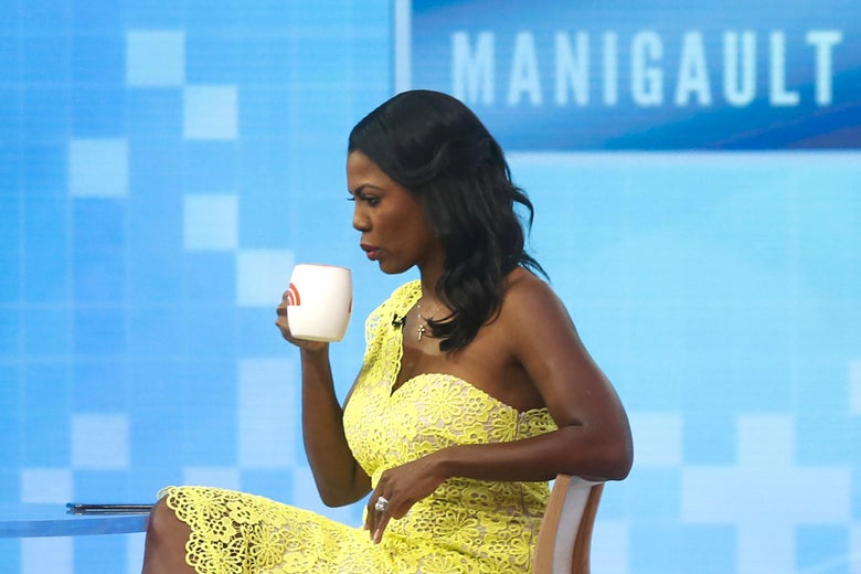 Omarosa drinks from a mug on the set of the Today show.